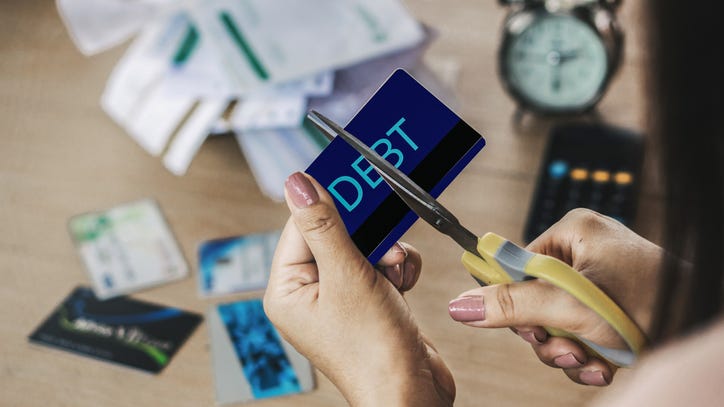 Teacher who wiped out savings to adopt former student and his brother pays off $48k in debt