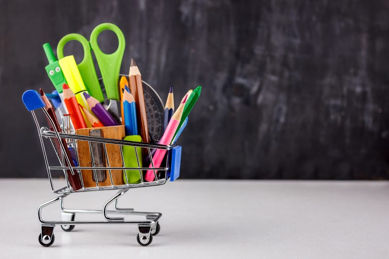 School supplies in a shopping cart. 