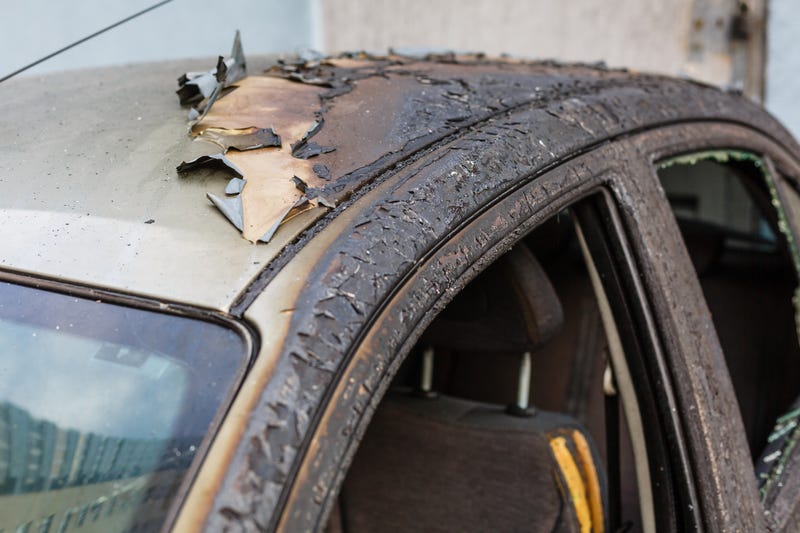 The burnt body of a car. 