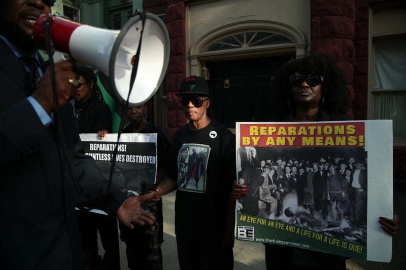 Activists outside Sen. McConnell's D.C. home on National Reparations Day 2019.