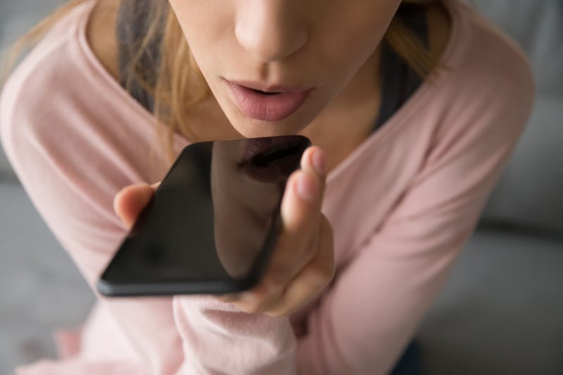 Woman has conversation on speakerphone