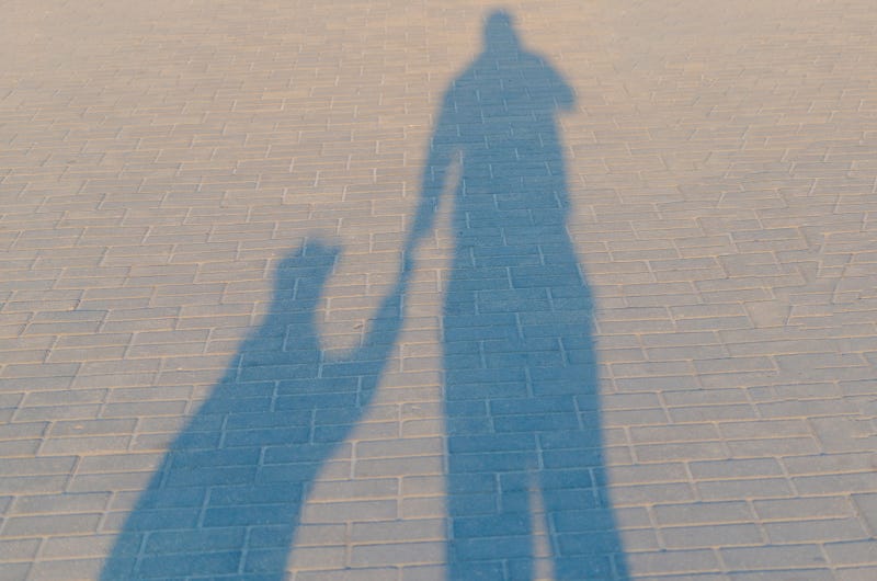 Man holding a girl's hand