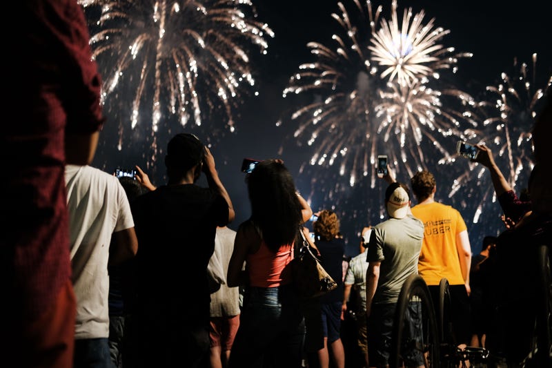 Fireworks light up the night sky over Brooklyn.