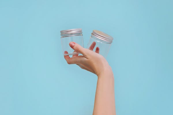 Woman holding empty jars