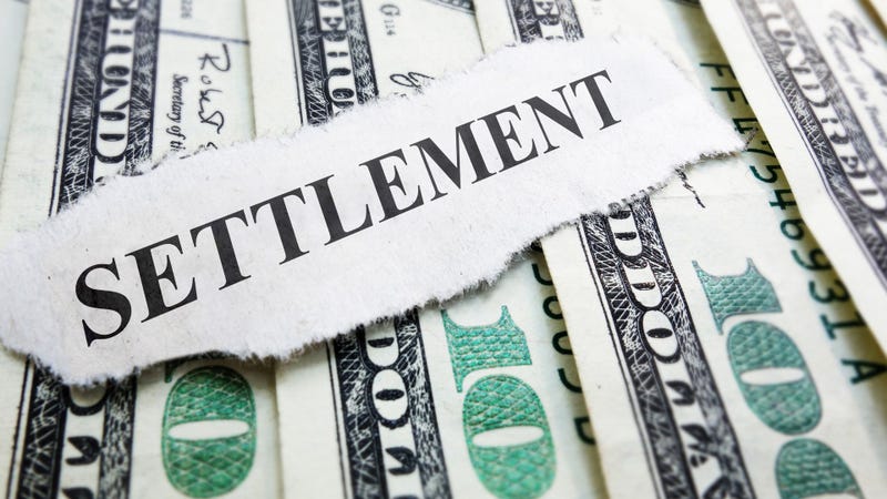 Settlement newspaper headline on money