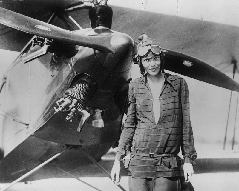 Amelia Earhart stands June 14, 1928 in front of her bi-plane called "Friendship" in Newfoundland.