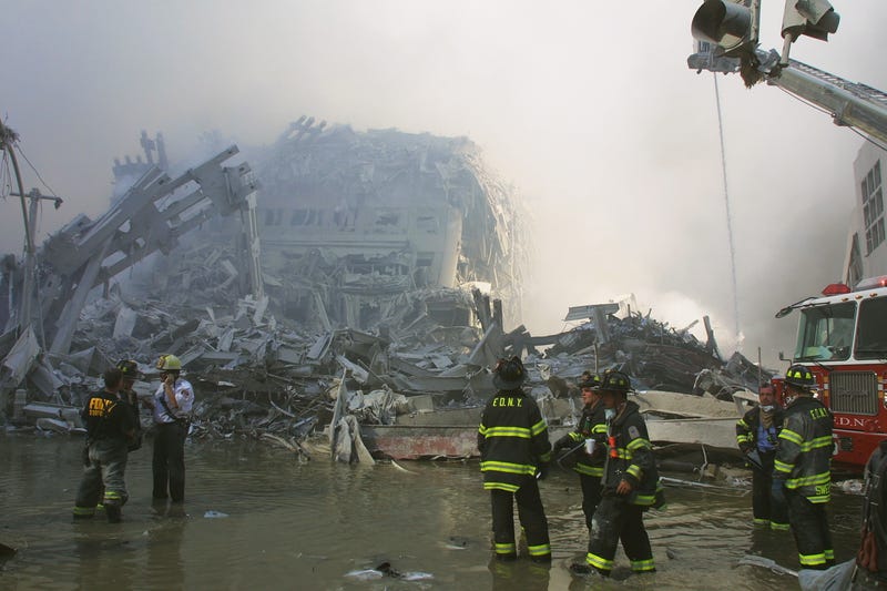 Firefighters work at Ground Zero in the days after the terrorist attack
