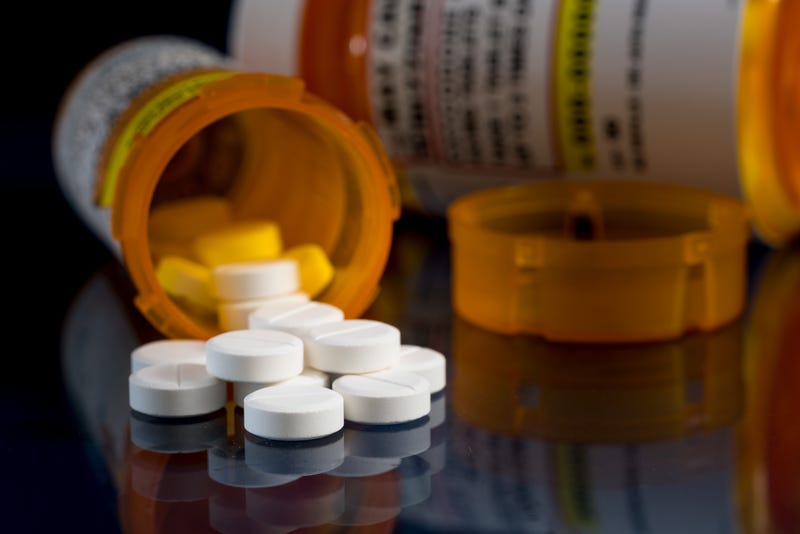 pills spilling out of bottle on tabletop