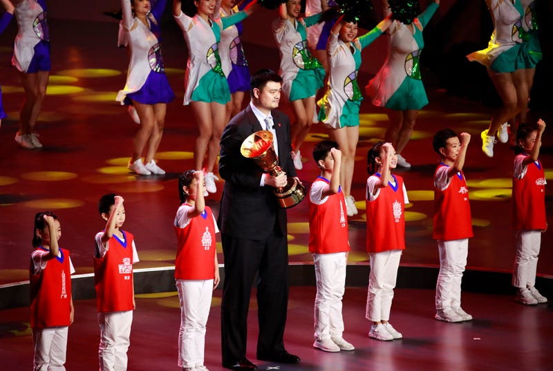 Former Chinese NBA player Yao Ming holds the FIBA World Cup trophy during the FIBA Basketball World Cup 2019 opening ceremony at the Beijing National Aquatics Center or Water Cube on 30 August 2019