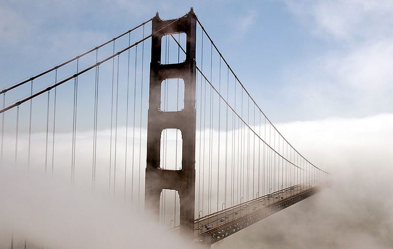 The north tower of the Golden Gate Bridge is visible as fog rolls in October 3, 2001 as seen from Marin, Calif.
