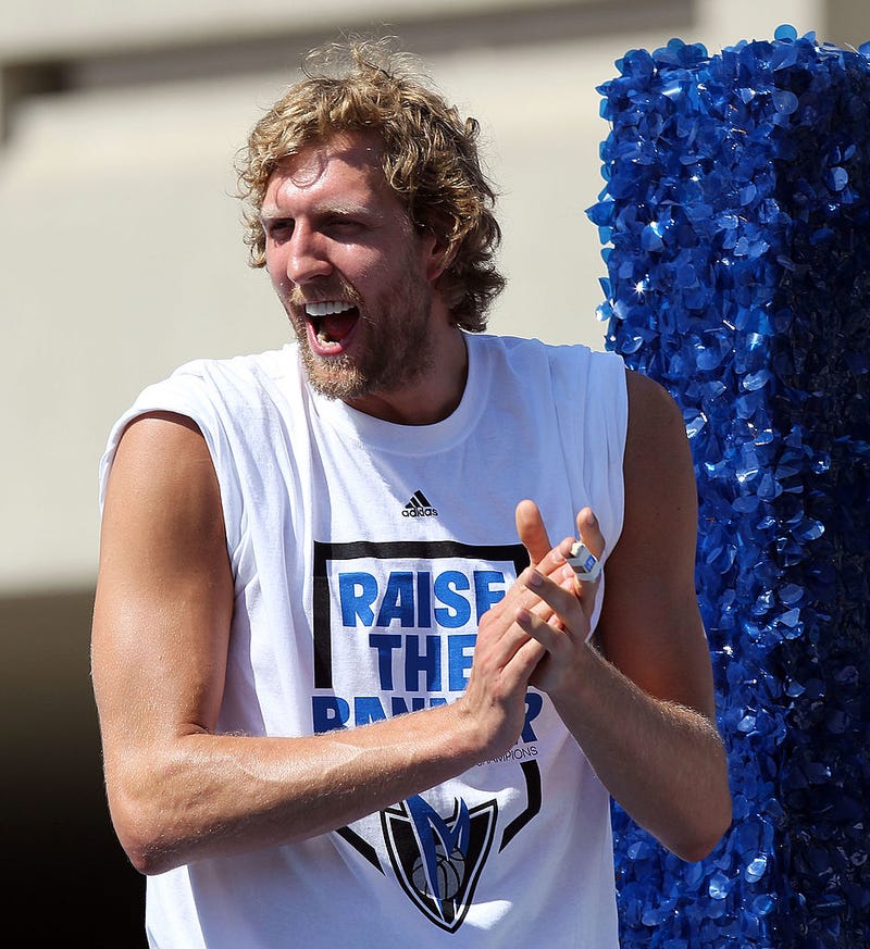 Dirk Nowitzki of the Dallas Mavericks cheers during the Dallas Mavericks Victory Parade on June 16, 2011 in Dallas, Texas. (Photo by Ronald Martinez/Getty Images)