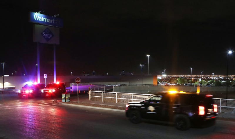 Police keep watch outside Walmart near the scene of a mass shooting which left at least 20 people dead on Aug. 3, 2019, in El Paso, Texas.