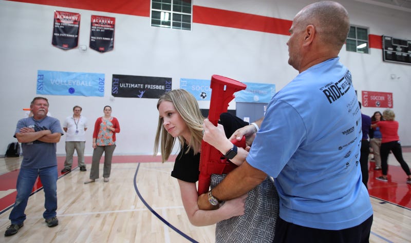 PROVO, UT - SEPTEMBER 04: Teachers from Freedom Preparatory Academy practices with each other on how to disarm a shooter with a dummy rifle and fight back during an active shooter event on September 4, 2019 in Provo, Utah. (Photo by George Frey/Getty Images)