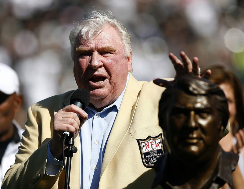 John Madden taps his bust during his Hall of Fame ceremony before the game as the Oakland Raiders defeated the Arizona Cardinals by a score of 22 to 9 at McAfee Coliseum, Oakland, California, October 22, 2006. 