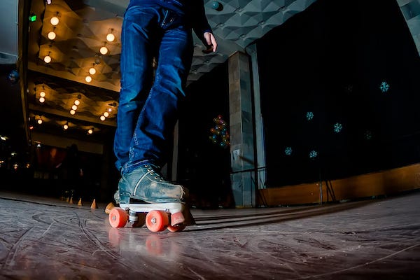 Man skating at a roller rink