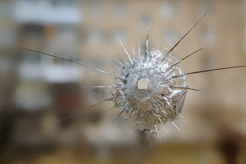Bullet hole in window