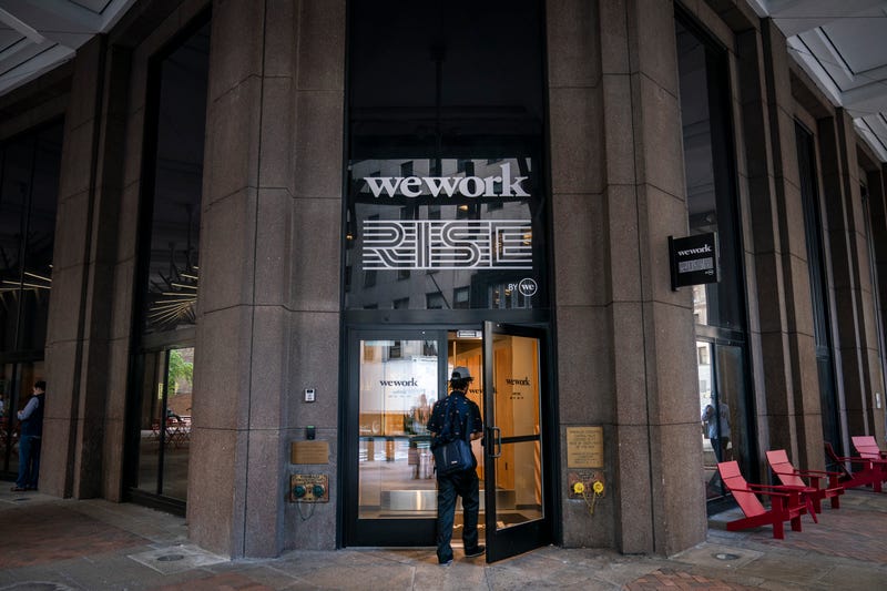 A man enters a WeWork office facility in the Financial District on Sept. 13, 2019