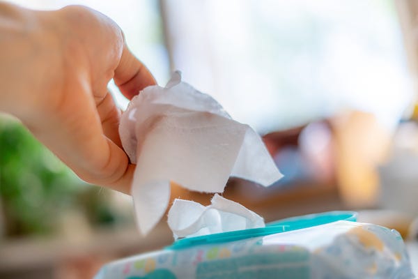 Adult grabbing wet wipes
