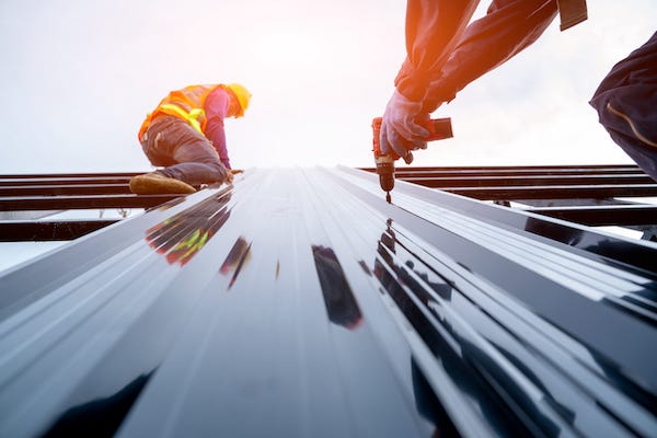 Construction workers working on steel building