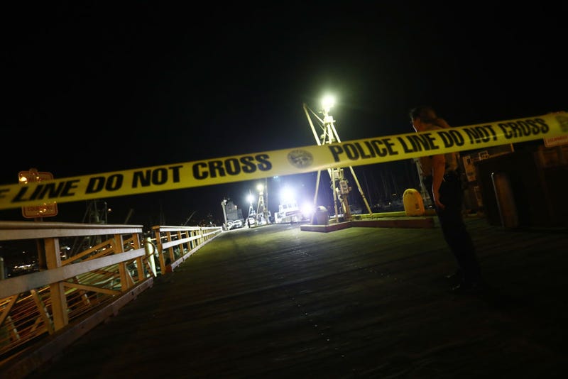 A police officer keeps watch on a pier where deceased victims from the sunken diving ship Conception were taken ashore on September 3, 2019 in Santa Barbara, California.
