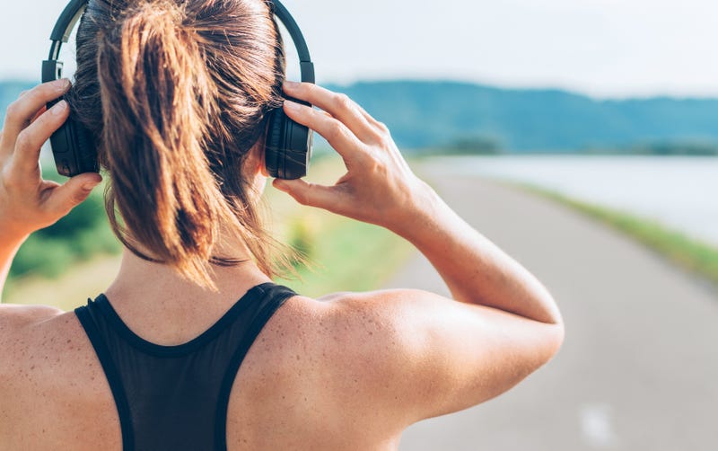woman running with headphones