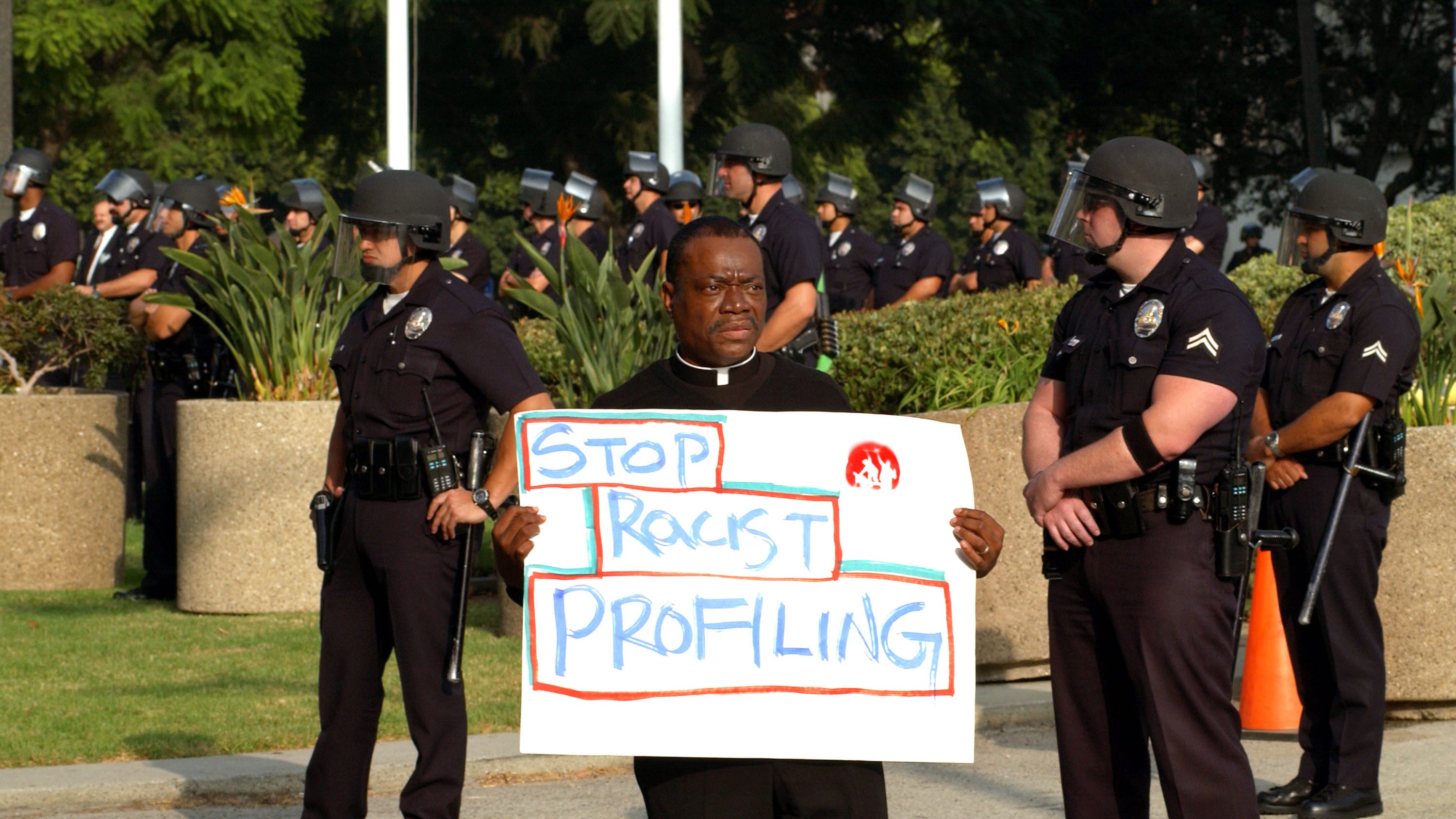 Pastor sues police for arresting him while watering a neighbor's flowers