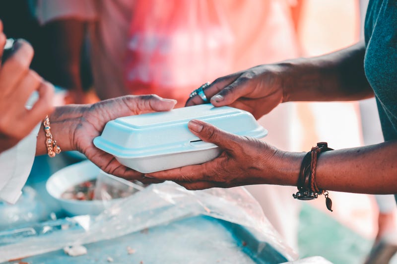 Feeding homeless people.