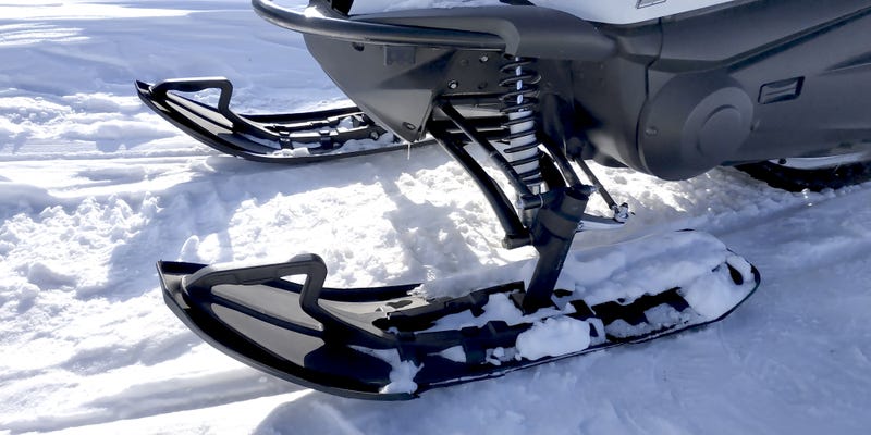 A Lansing area woman is dead after authorities say she was ejected from her snowmobile after hitting a tree stump in the Upper Peninsula on Thursday afternoon.