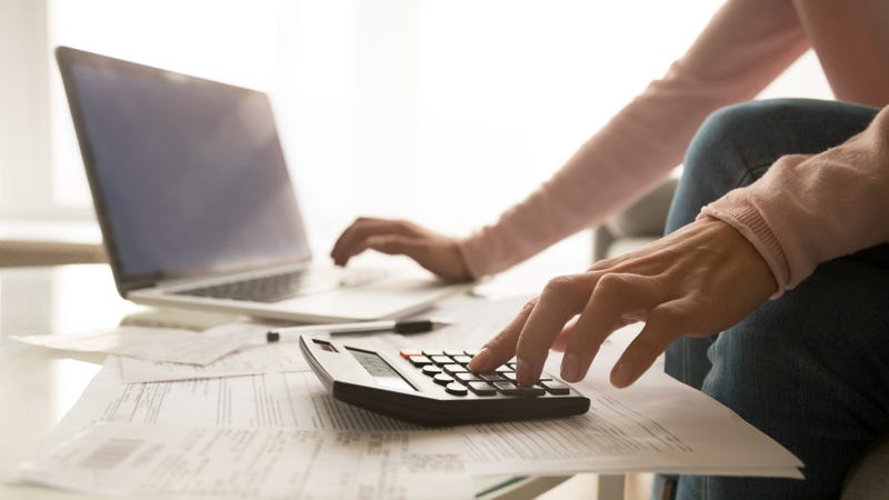 Close up of woman managing home bills 
