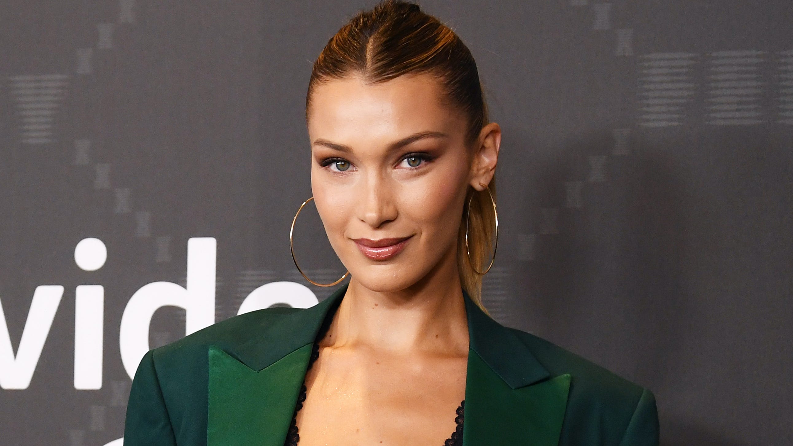 Bella Hadid displays her supermodel physique in a red string bikini