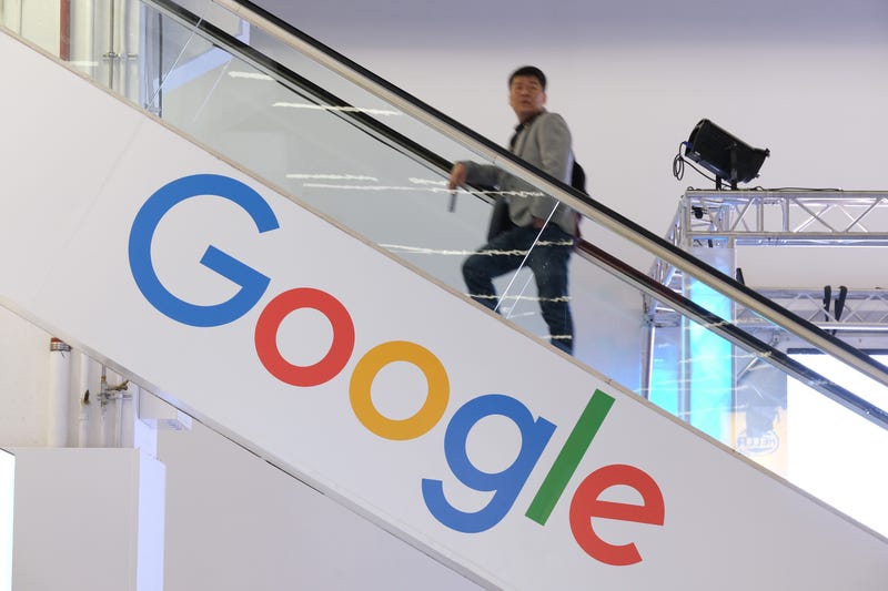 The Google logo adorns an escalator.