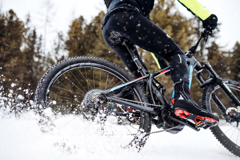 Person riding a bike in the snow.