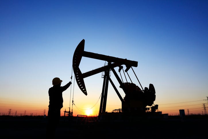 Oil workers working in an oil field.