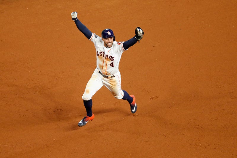 George Springer celebrates Jose Altuve's series-clinching home run against the Yankees