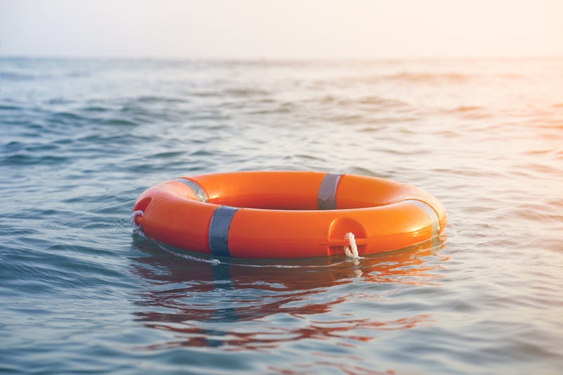 Orange inner tube on a lake