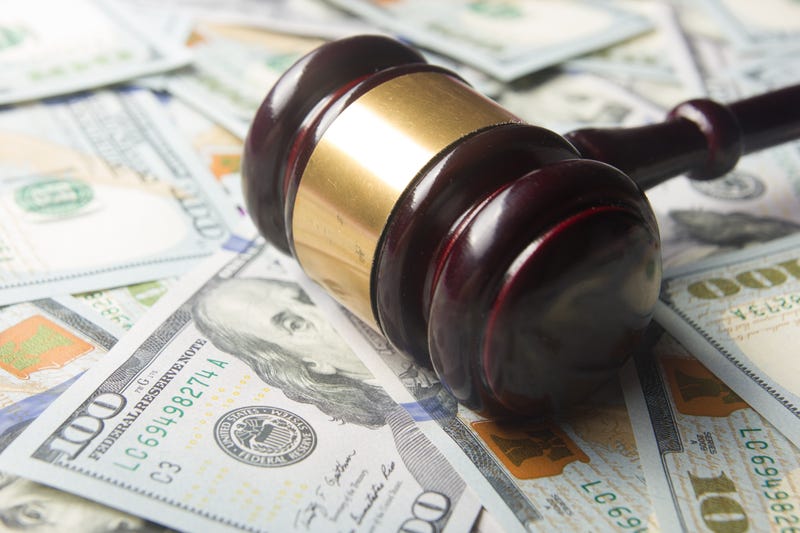 Gavel on top of pile of money