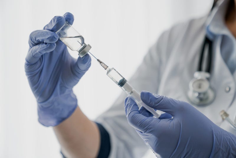 Nurse filling syringe