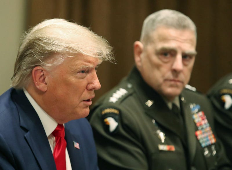 U.S. President Donald Trump speaks as Joint Chiefs of Staff Chairman, Army Gen. Mark Milley looks on after getting a briefing from senior military leaders in the Cabinet Room at the White House on October 7, 2019 in Washington, DC. 