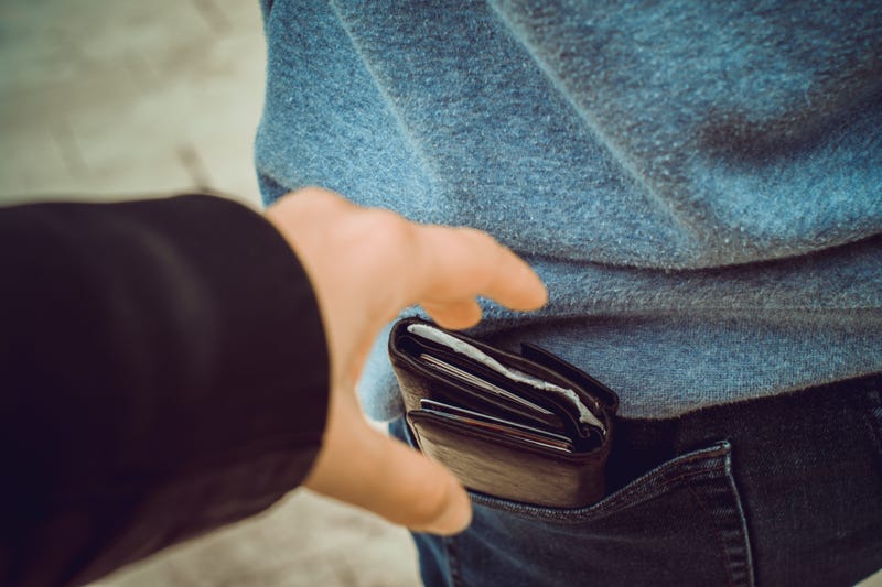 Stealing wallet from a back pocket.