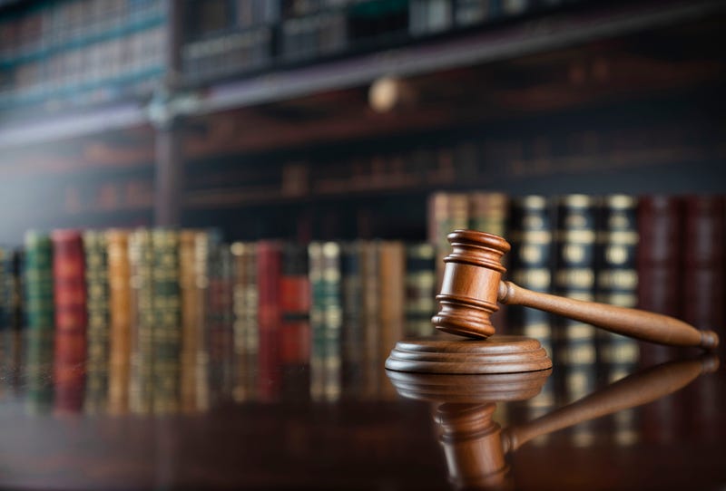 Gavel and books in court building