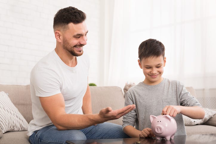 Father and son with money