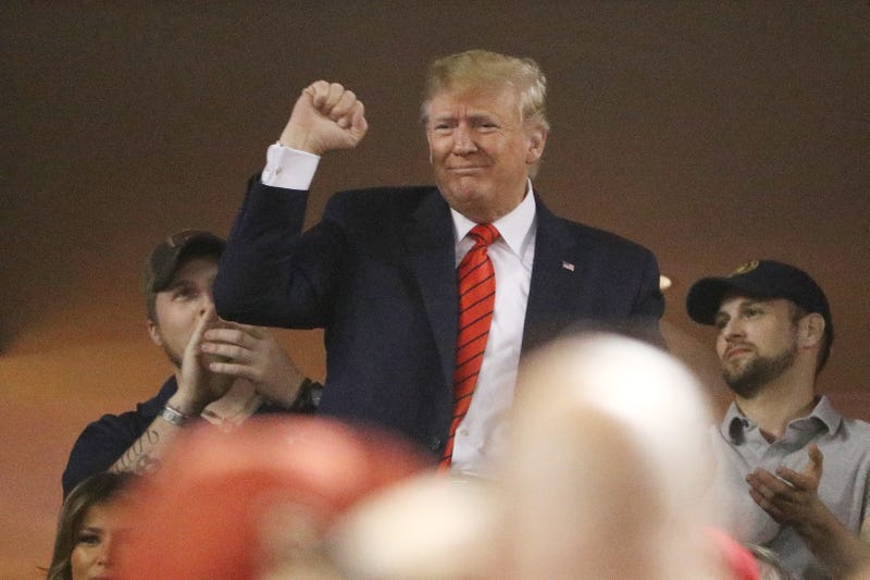 File photo: President Donald Trump attends Game Five of the 2019 World Series between the Houston Astros and the Washington Nationals at Nationals Park on October 27, 2019 in Washington, DC