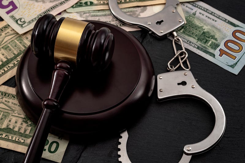 Gavel, cash and handcuffs