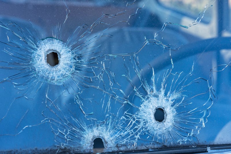 Bullet holes in a car windshield