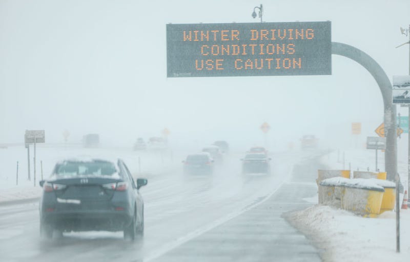 Drivers make their way along slick and snowy roads on November 26, 2019 in Denver, Colorado.