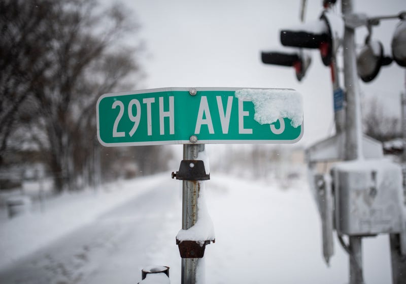 No, it's not going to snow (much). A street sign is covered in snow after a blizzard struck overnight on November 27, 2019 in Minneapolis, Minnesota on one of the busiest travel days of the year. It'll be cold this year, but no major storms are in sight.