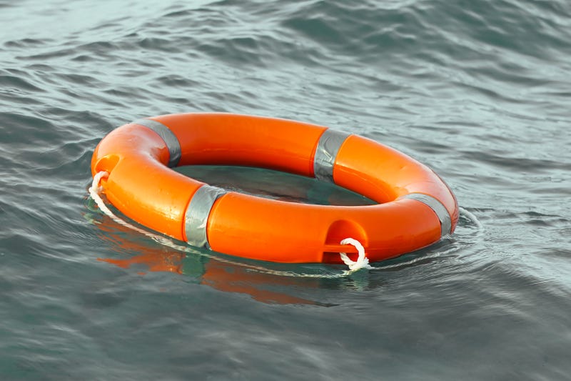 Life ring floating on top of water.
