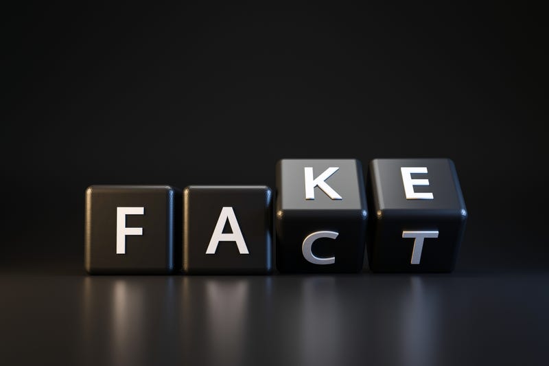 Tiles turning from reading "FACT" to "FAKE"