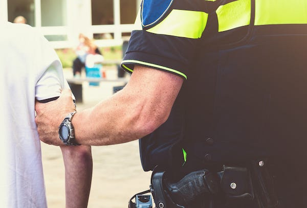 Police arresting student at school