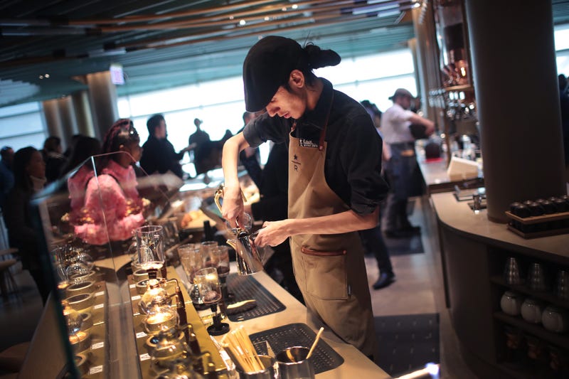 CHICAGO, ILLINOIS - NOVEMBER 12: A worker prepares drinks during a media preview at Starbucks Reserve Roastery on November 12, 2019 in Chicago, Illinois. With 35,000 square feet over four floors and a rooftop deck, the restaurant, which opens to the public on November 15, will be the company's largest. The restaurant features a cocktail bar, a reserve coffee bar, and experimental coffee bar and a bakery and cafe, each on separate levels. 